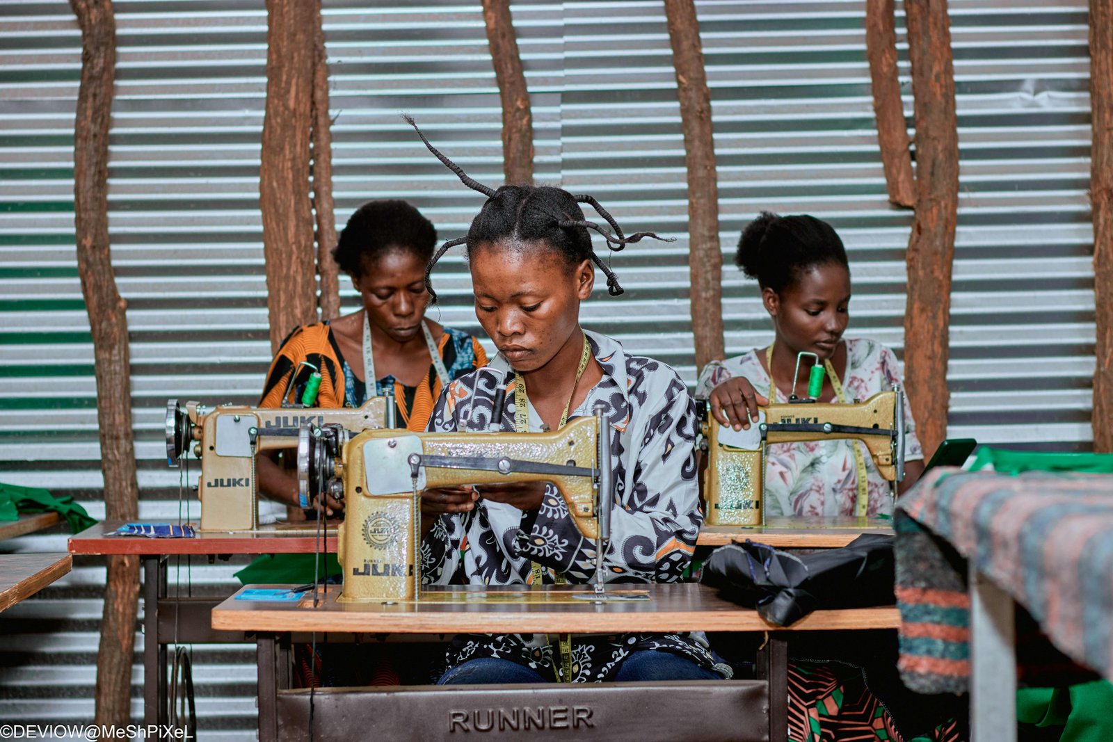 Women engaged in hands-on sewing practice